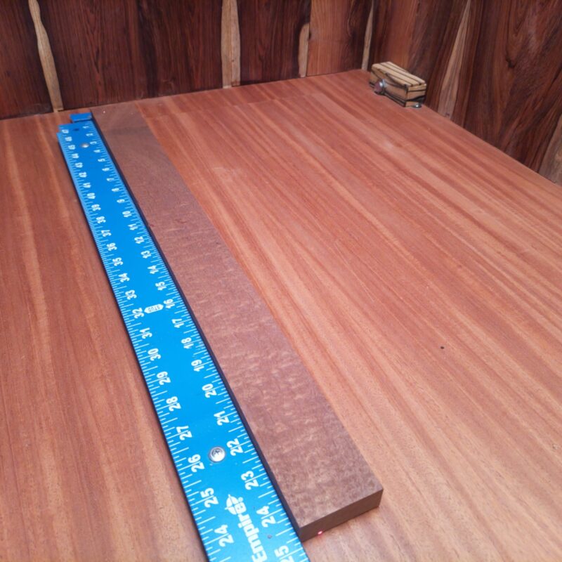 Bubinga 0.8" X 2.2" X 24.7" Wood Blank for Woodworking Projects - ABDL001202 6 Picture this: a luxurious serving tray and wooden coasters from this amazing Bubinga wood, making your dinner parties a hit! Or how about some unique candle holders to brighten up those cozy evenings? Don't forget those high-end drawer pulls—they scream sophistication! With soft, smooth wood, this beauty can jazz up your guitar neck, too. In short, whether it's decor or utility, this wood is pure class! This piece of Bubinga measures 0.8 inches by 2.2 inches by 24.7 inches, offering a high-quality option for a variety of woodworking projects.