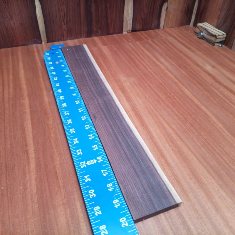 Unlock the full potential of your acoustic guitar with this durable quarter-sawn Amazon Rosewood blank. Perfect for luthiers looking to create stunning fingerboards, it boasts a rich tonal quality and a beautiful finish that enhances playability. Bring your craftsmanship to life with this uniquely sourced wood that promises to elevate any instrument's sound and aesthetics. Your next custom build deserves this high-quality, reliable fingerboard! It is a Amazon Rosewood Acoustic Quarter Sawn fingerboard blank with dimensions of 20.0 x 2.8 x 0.4 inches.