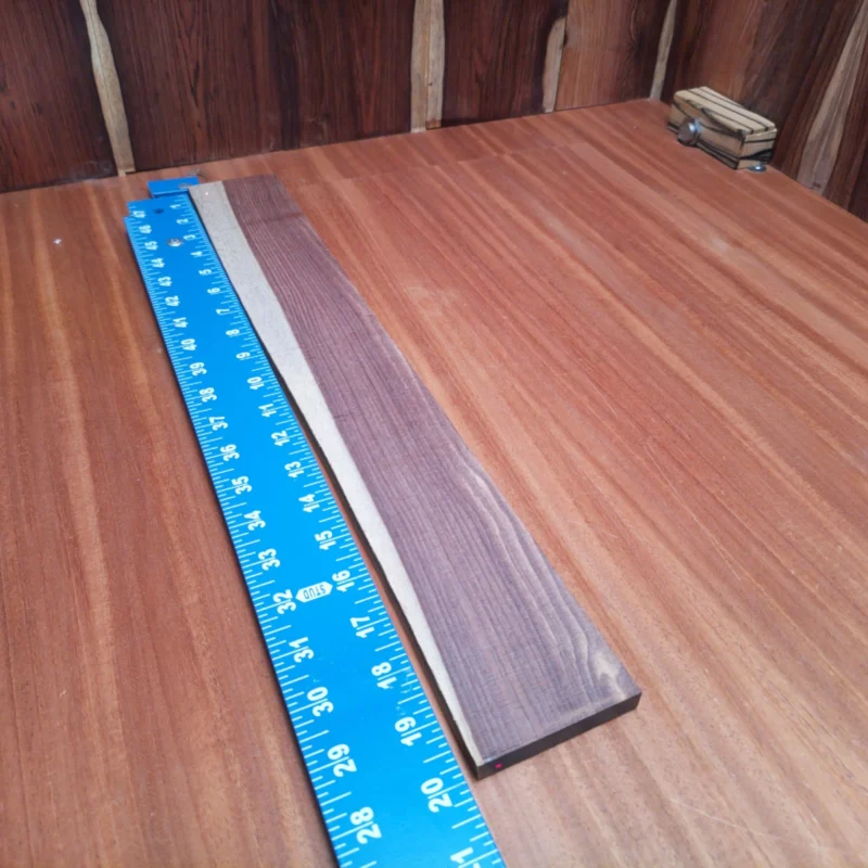 Craft your next acoustic masterpiece with this premium quarter-sawn rosewood! Perfect for luthiers, it offers both beauty and strength. Unlock your creativity with a blank that enhances tone and projection. This instrument-grade wood boasts rich tonal qualities while maintaining durability for endless playability. Get ready to shape your dream sound! It is a Amazon Rosewood Acoustic Quarter Sawn fingerboard blank with dimensions of 19.8 x 2.7 x 0.4 inches.