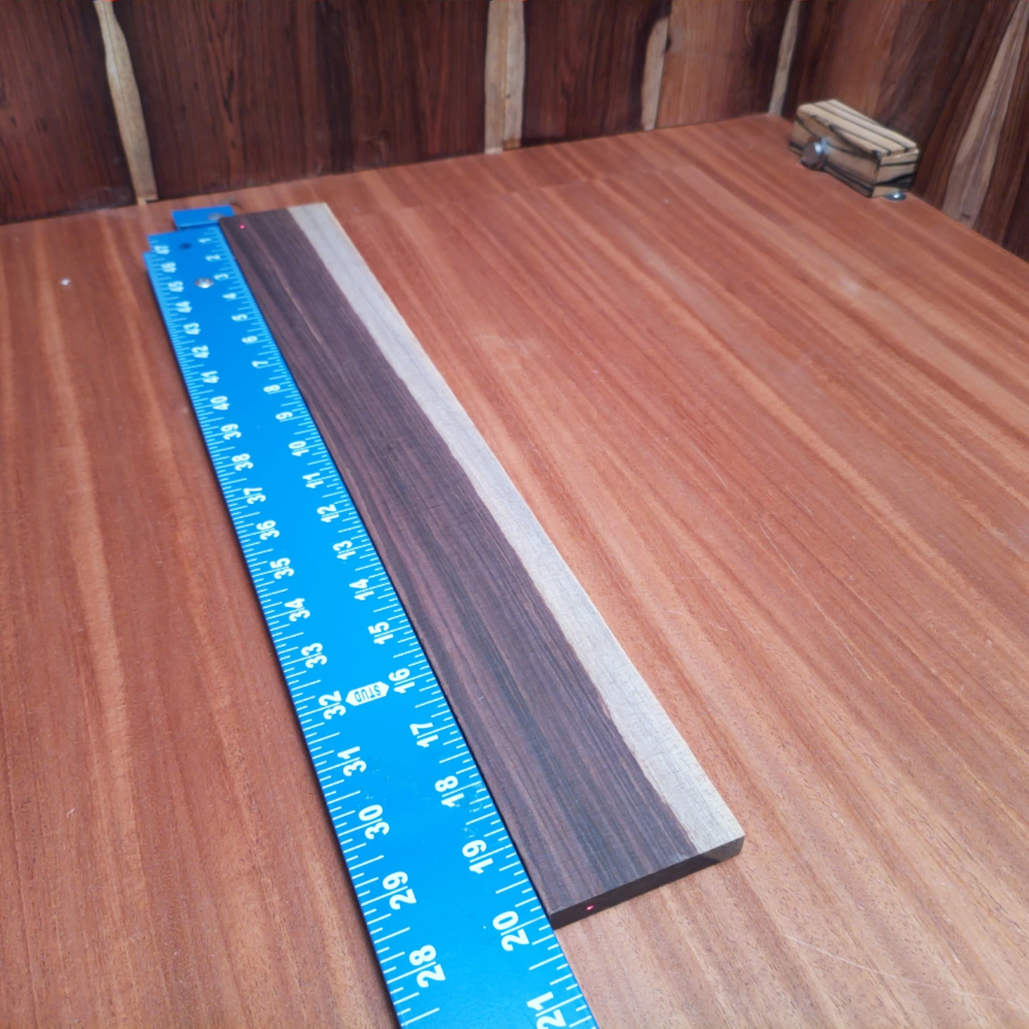 Amazon Rosewood Acoustic Quarter Sawn Fingerboard Blank 0.4" X 2.7" X 20.0" - ARAFBQ000679 1 Crafted from premium quarter-sawn Amazon rosewood, this fingerboards blank offers unmatched tonal clarity and stability. Perfect for luthiers looking to create exceptional acoustic instruments, it ensures a rich sound and stunning visual appeal. With its perfect dimensions and high-quality finish, this blank is your go-to choice for professional-grade fingerboards, whether you're building a custom guitar or enhancing an existing masterpiece. It is a Amazon Rosewood Acoustic Quarter Sawn fingerboard blank with dimensions of 20.0 x 2.7 x 0.4 inches.