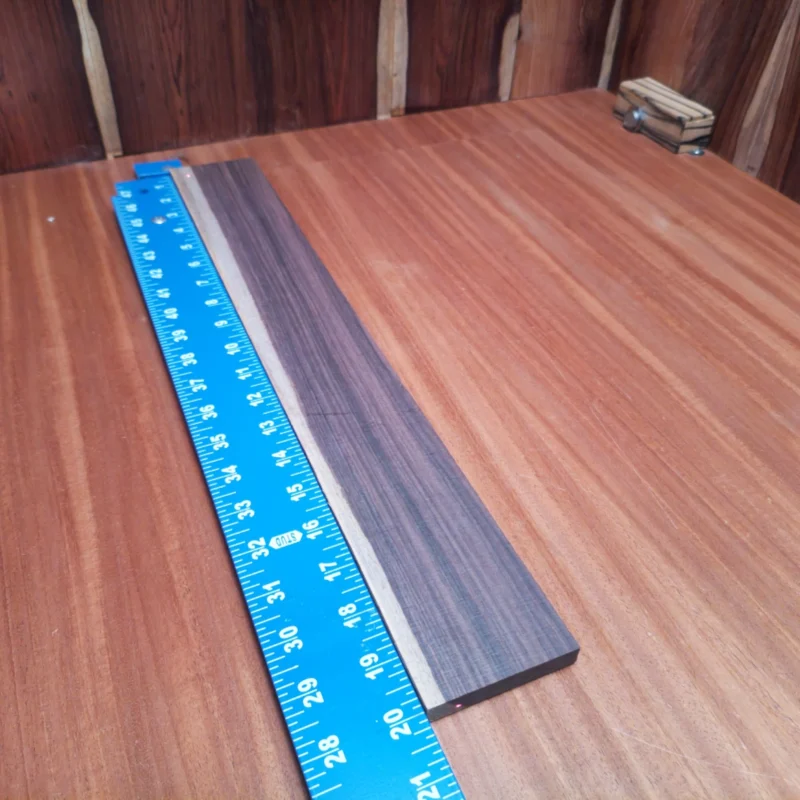 Amazon Rosewood Acoustic Quarter Sawn Fingerboard Blank 0.4" X 2.7" X 20.0" - ARAFBQ000679 3 Crafted from premium quarter-sawn Amazon rosewood, this fingerboards blank offers unmatched tonal clarity and stability. Perfect for luthiers looking to create exceptional acoustic instruments, it ensures a rich sound and stunning visual appeal. With its perfect dimensions and high-quality finish, this blank is your go-to choice for professional-grade fingerboards, whether you're building a custom guitar or enhancing an existing masterpiece. It is a Amazon Rosewood Acoustic Quarter Sawn fingerboard blank with dimensions of 20.0 x 2.7 x 0.4 inches.
