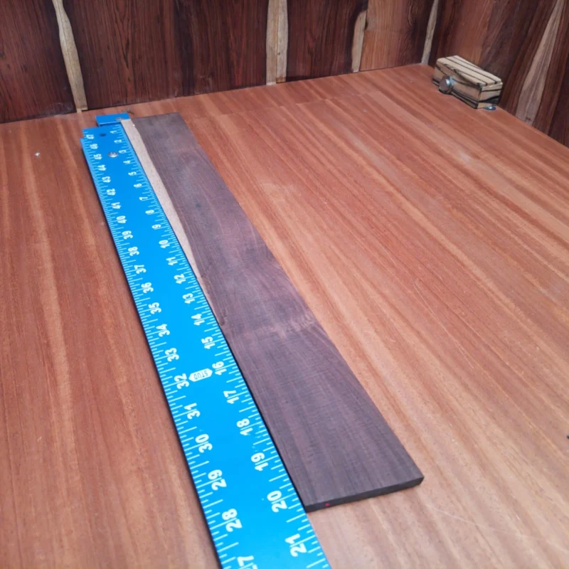 Unlock your music creativity with this premium rosewood fingerboard blank, perfect for crafting. Its beautiful quarter sawn grain enhances both sound and aesthetics, ensuring a stunning finish on every instrument. Ideal for luthiers aiming to create a top-quality acoustic experience, this fingerboard blank combines durability and rich tonal qualities for ideal playability. Level up your projects with this sought-after material that every serious luthier will love! It is a Amazon Rosewood Acoustic Quarter Sawn fingerboard blank with dimensions of 20.3 x 2.7 x 0.3 inches.