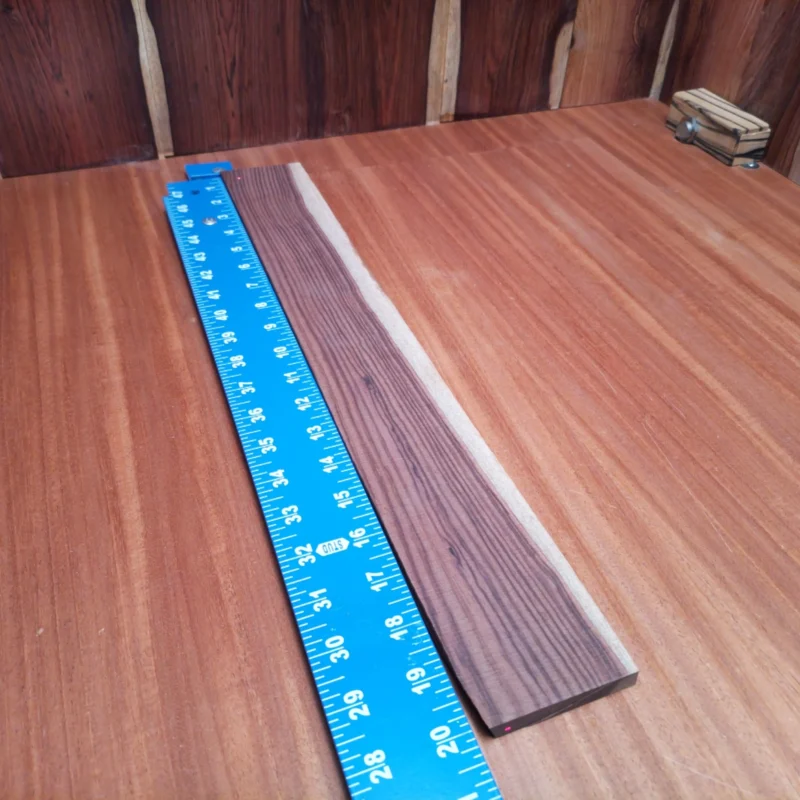 Amazon Rosewood 16 Unleash your creativity with this top-quality acoustic fingerboard blank made from Amazon Rosewood. Crafted for luthiers seeking durability and stunning aesthetics, this blank is perfect for your next custom build. With its vibrant grain patterns and rich tonal properties, you’ll be able to carve out a masterpiece that resonates beautifully. Transform your ideas into reality and enjoy the craftsmanship that comes into play with this gorgeous wood! It is a Amazon Rosewood Acoustic Rift Sawn fingerboard blank with dimensions of 20.0 x 2.6 x 0.4 inches.