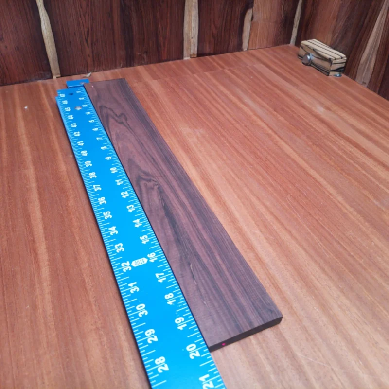Crafted for precision and durability, this fingerboard blank is made from high-quality Amazon Rosewood. Perfect for luthiers seeking to enhance their acoustic guitars, its stunning grain adds both beauty and character to any instrument. With a comfortable size, this blank provides sufficient material for shaping and styling, ensuring maximum playability. Elevate your craftsmanship with this fingerboard blank that marries aesthetic appeal with functional reliability. It is a Amazon Rosewood Acoustic Rift Sawn fingerboard blank with dimensions of 20.0 x 2.8 x 0.4 inches.