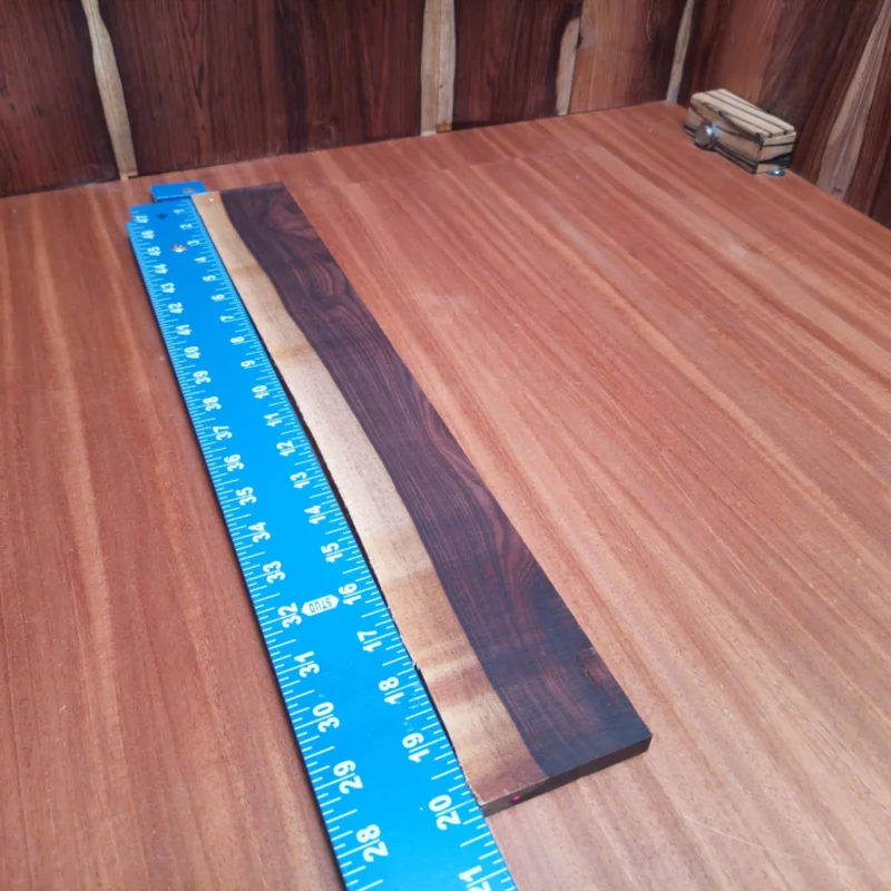 Crafted from premium Amazon rosewood, this fingerboard blank is perfect for building stunning acoustic instruments. Its rift-sawn grain offers both beauty and durability, making it an ideal choice for luthiers looking to enhance their craftsmanship. Enjoy the smooth finish and rich tonal qualities that this fingerboard blank provides, elevating your instruments to new heights. Experience the difference with this reliable and versatile wood option. It is a Amazon Rosewood Acoustic Rift Sawn fingerboard blank with dimensions of 19.9 x 2.6 x 0.4 inches.