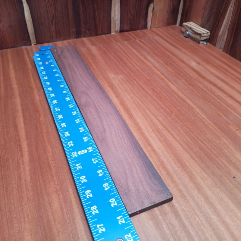 Elevate your luthiery game with this premium Amazon rosewood fingerboard blank. Crafted for superior acoustic performance, this piece will help you create beautifully resonant instruments. Its rift-sawn profile ensures exceptional stability and grain aesthetics, perfect for enhancing both the sound and visuals of your acoustic guitars. Ready to take your craftsmanship to new heights? It is a Amazon Rosewood Acoustic Rift Sawn fingerboard blank with dimensions of 20.9 x 2.7 x 0.5 inches.
