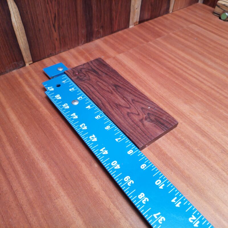 Craft something extraordinary with this luxurious piece of Amazon Rosewood - from a custom guitar pick to a stylish business card holder, the possibilities are endless. While you’re at it, why not create a beautiful wood inlay for that dull piece of furniture? Or a keychain that’s more unique than your ex's taste in music? Your imagination is the only limit when it comes to shaping this exquisite wood! This piece of Amazon Rosewood measures 0.3 inches by 2.9 inches by 7.9 inches, offering a high-quality option for a variety of woodworking projects.
