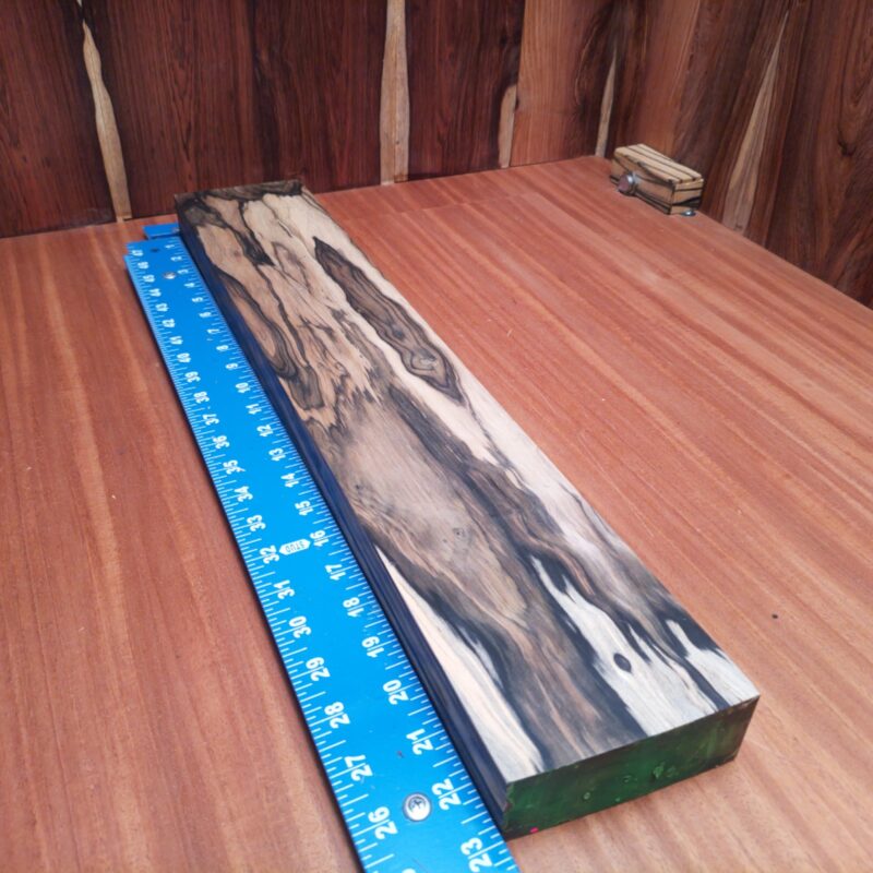 Crafted from the wonders of Black and White Ebony, imagine making luxurious knife handles or delicate wooden spoons—talk about class! You can elevate your decor with unique wall art and personalized nameplates that even your guests will envy. Whether you're into custom guitar fingerboards or stylish drawer pulls, this exquisite wood practically weaves itself into all things fabulous! This piece of Black and White Ebony measures 1.6 inches by 4.2 inches by 23.0 inches, offering a high-quality option for a variety of woodworking projects.
