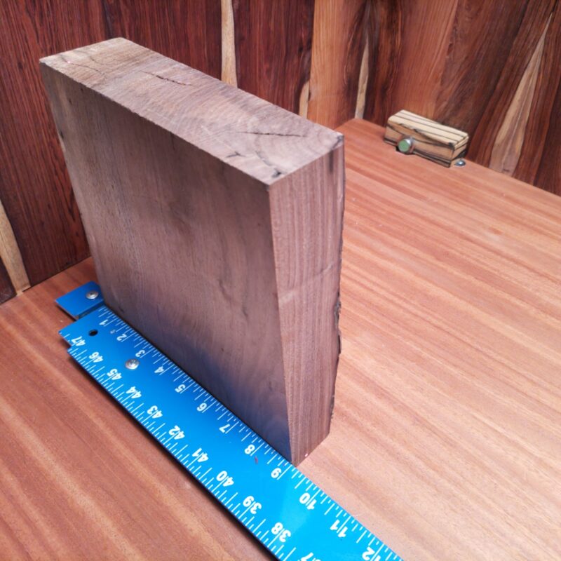 This Claro Walnut is no ordinary wood; it's a transformation machine! Turn it into elegant serving trays, fancy jewelry boxes, or even high-end wine racks for your next dinner party. Why settle for average when you can have custom drawer fronts or a unique wooden chess set? Your guests won't just see wood; they'll see luxury. This piece of Claro Walnut measures 2.4 inches by 8.7 inches by 8.0 inches, offering a high-quality option for a variety of woodworking projects.