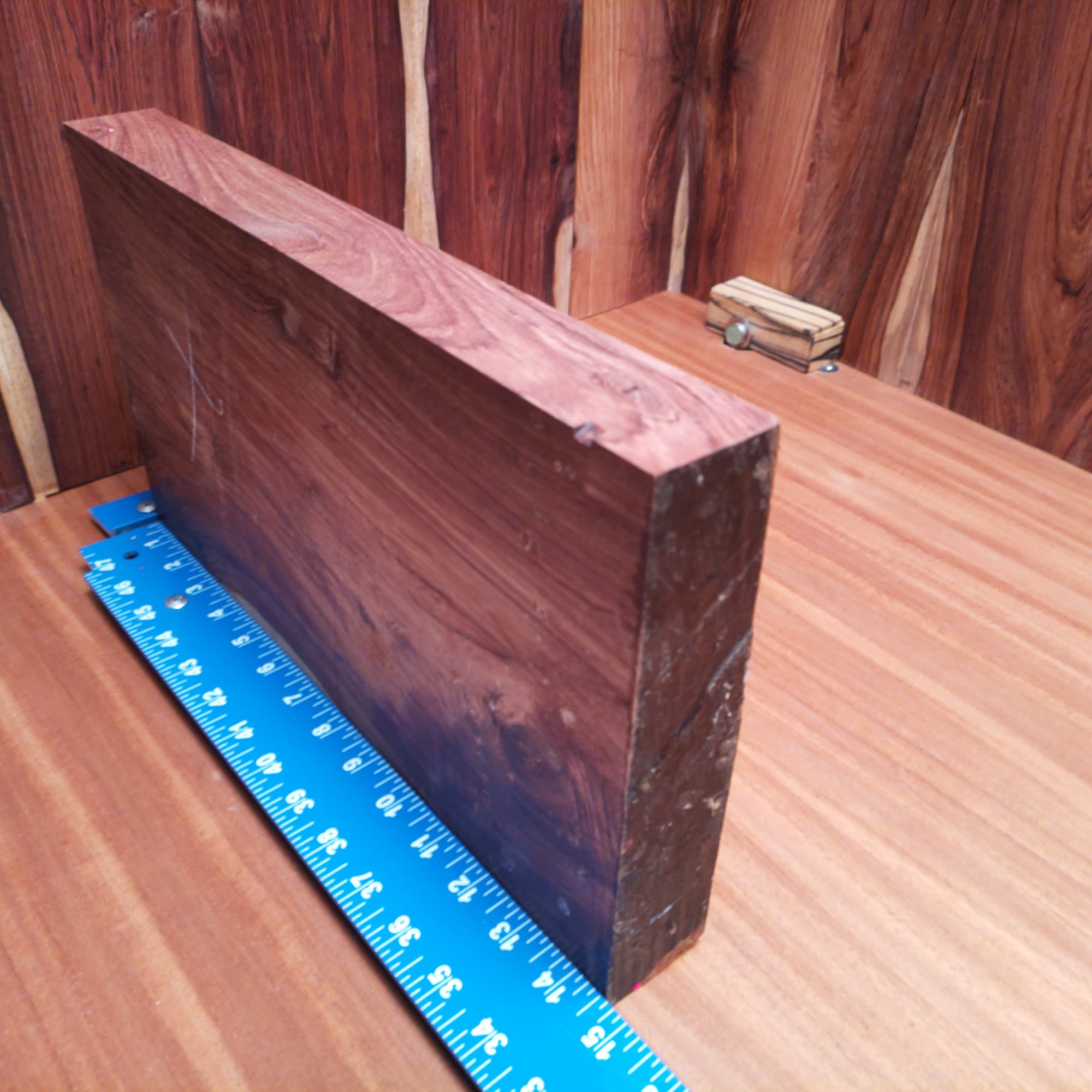 Honduran Rosewood Burl 1.6" X 8.5" X 14.7" Wood Blank for Woodworking Projects - HBDL001139 4 Crafting with Honduran Rosewood Burl opens the door to endless creative possibilities! Imagine an elegant desk organizer or a unique candle holder that's sure to light up the room. We’re talking about a luxe charcuterie board that can double as a table centerpiece, or bespoke drawer pulls that steal the show in any room. Why not boost your space with some artful bookends too? Transform your wood into grandeur with effortless style! This piece of Honduran Rosewood Burl measures 1.6 inches by 8.5 inches by 14.7 inches, offering a high-quality option for a variety of woodworking projects.
