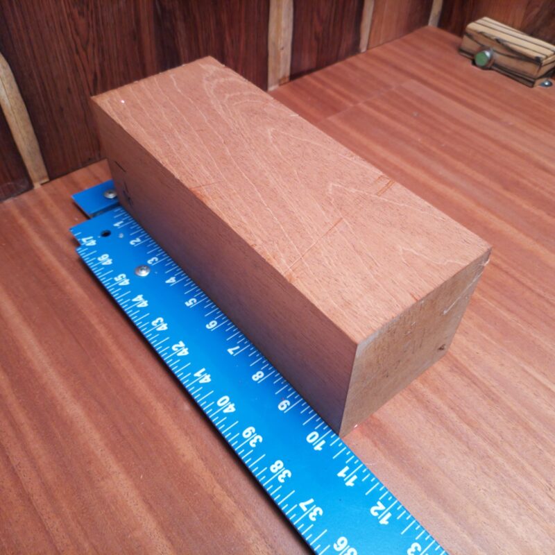 Transform your piece of Honduran Mahogany G1 into a multitude of wonders! With this premium wood, you can create essential coasters, high-end candle holders, and a unique rustic signpost that will surely spark conversations. Or how about conjuring up a wood-turned bowl and delightful picture frame? This wood is your blank canvas, ready for creativity, fun, and a pinch of elegance! This piece of Honduran Mahogany measures 3.8 inches by 3.8 inches by 10.2 inches, offering a high-quality option for a variety of woodworking projects.