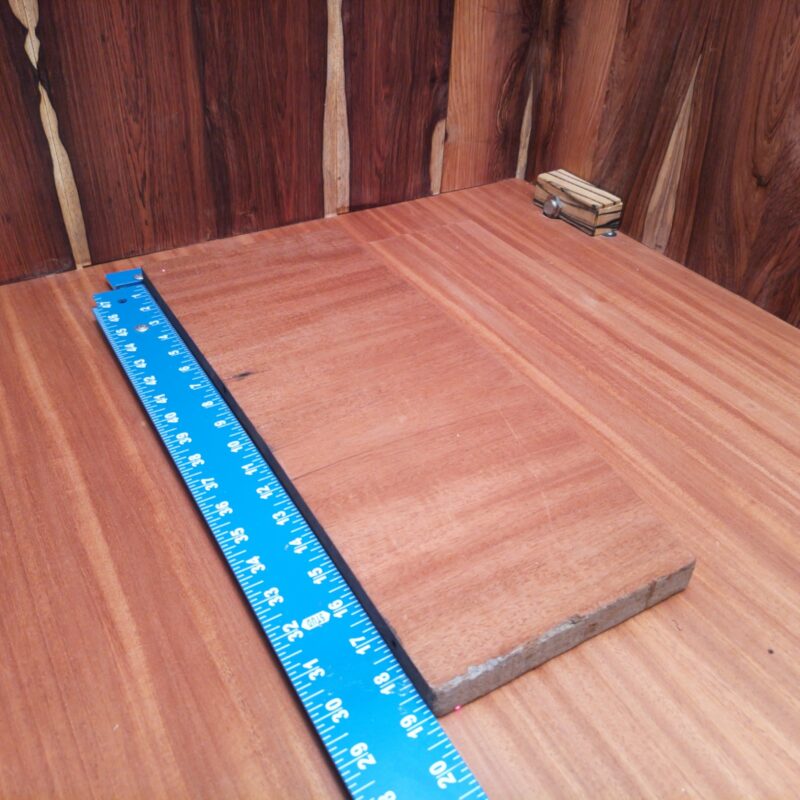 With a stunning piece of Honduran Mahogany, the possibilities are endless! Transform it into a luxury picture frame, or impress your guests with a custom cutting board. Maybe you'd like to jazz up your living room decor with an artistic wall shelf, or even surprise your furry friend with a handcrafted pet feeding station! This wood is so versatile, it could easily steal the show in any project! This piece of Honduran Mahogany measures 0.9 inches by 6.2 inches by 18.8 inches, offering a high-quality option for a variety of woodworking projects.
