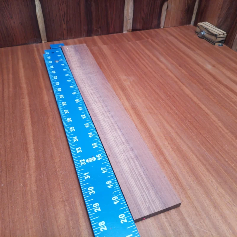 Fingerboard Blanks 26 Crafted from premium Honduran Rosewood, this acoustic fingerboard blank is perfect for luthiers seeking quality and reliability. With its quarter-sawn structure, it ensures stability and enhanced tonal qualities. Whether you're building a classic guitar or a modern acoustic, this fingerboard will elevate your craftsmanship. Experience the rich tones and smooth playability that only Honduran Rosewood can provide. It is a Honduran Rosewood Acoustic Quarter Sawn fingerboard blank with dimensions of 20.3 x 2.7 x 0.4 inches.