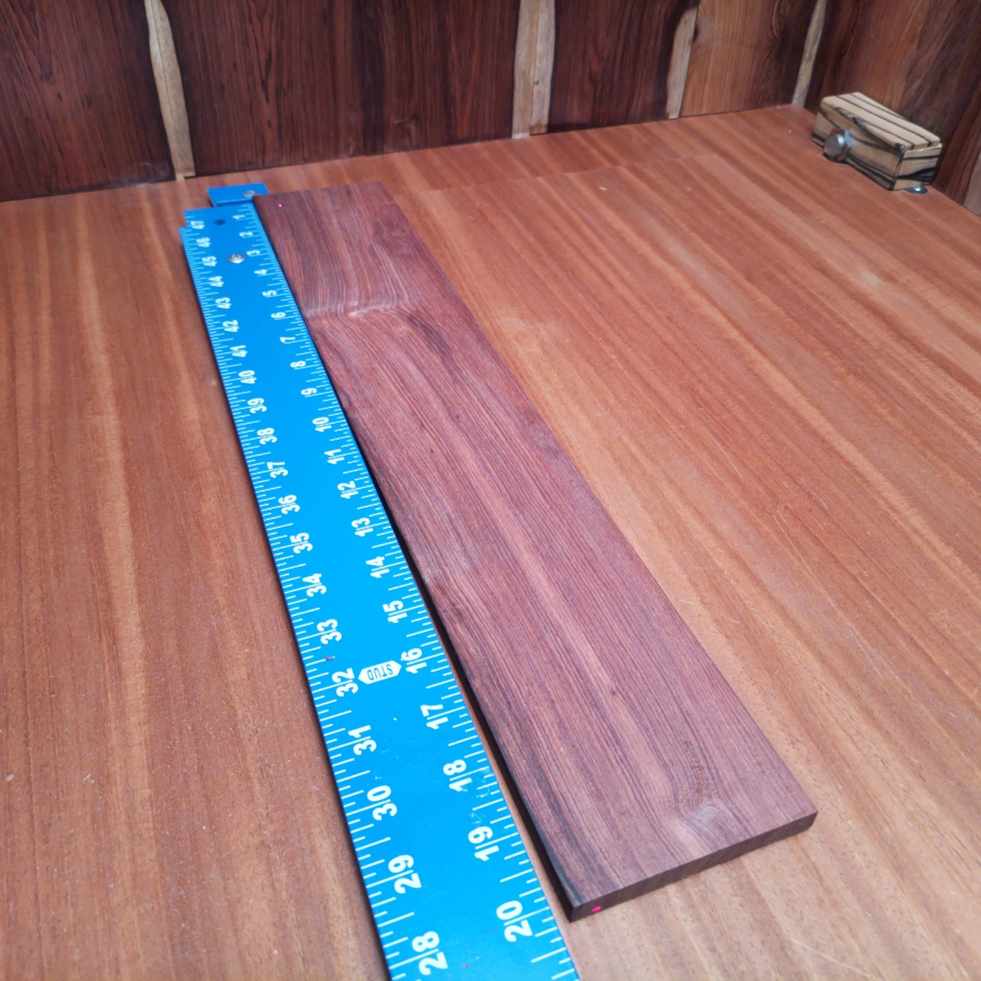 Honduran Rosewood Acoustic Quarter Sawn Fingerboard Blank 0.4" X 3.5" X 20.1" - HRAFBQ000653 1 Elevate your next acoustic creation with this premium Honduran Rosewood blank. Ideal for luthiers, this quarter-sawn wood features impressive tonal quality and stability. Its straight grain ensures effortless playability, making it a top choice for professional instruments. Whether crafting a striking guitar or a unique custom piece, this blank provides the perfect foundation for your artistic visions. Get ready to produce some trending sounds with this versatile wood! It is a Honduran Rosewood Acoustic Quarter Sawn fingerboard blank with dimensions of 20.1 x 3.5 x 0.4 inches.