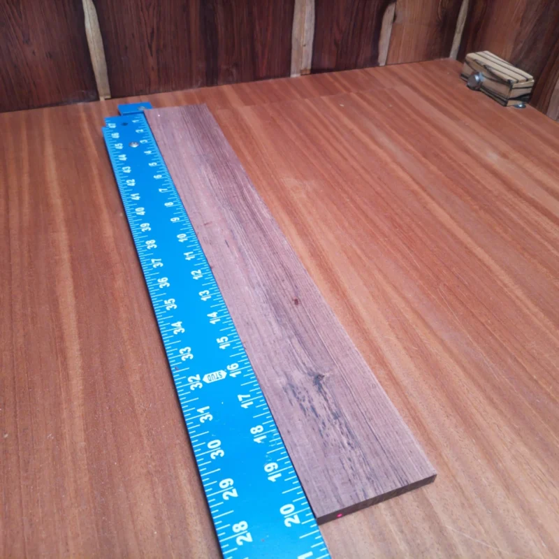 Fingerboard Blanks 25 Crafted from premium Honduran rosewood, this acoustic fingerboard blank promises exceptional tonal quality and durability. Its quarter-sawn grain provides unmatched stability, making it easier for luthiers to create stunning instruments. Whether you're building a guitar or a custom project, this blank is your perfect partner in crafting a masterpiece that resonates beautifully. Elevate your sound and enjoy effortless workability with this impressive material. It is a Honduran Rosewood Acoustic Quarter Sawn fingerboard blank with dimensions of 20.3 x 3.0 x 0.2 inches.