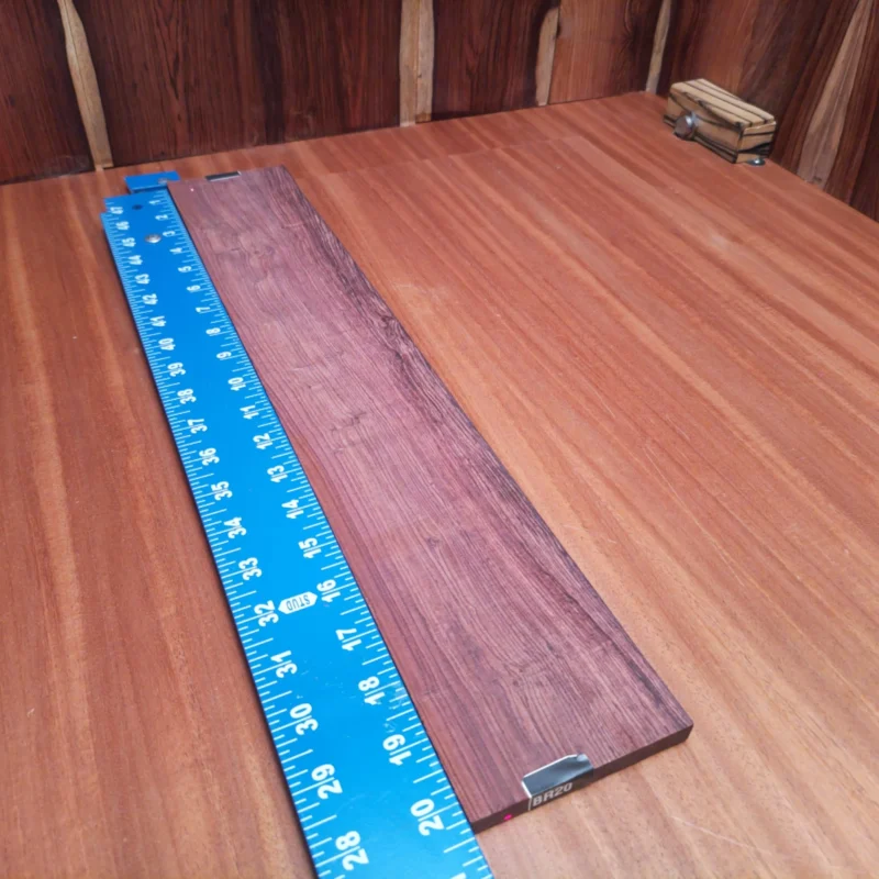 Unlock your creativity with this premium Honduran Rosewood fingerboard blank. Sourced from sustainable forests, this rift-sawn wood is perfect for crafting unique and vibrant acoustic guitars. Its incredible tonal qualities and luxurious appearance will elevate any instrument, making it a sought-after choice for luthiers looking to impress. Whether you're a seasoned professional or just starting your journey, this fingerboard blank will enable you to create beautifully sounding and stunningly crafted guitars. It is a Honduran Rosewood Acoustic Rift Sawn fingerboard blank with dimensions of 20.3 x 3.5 x 0.4 inches.