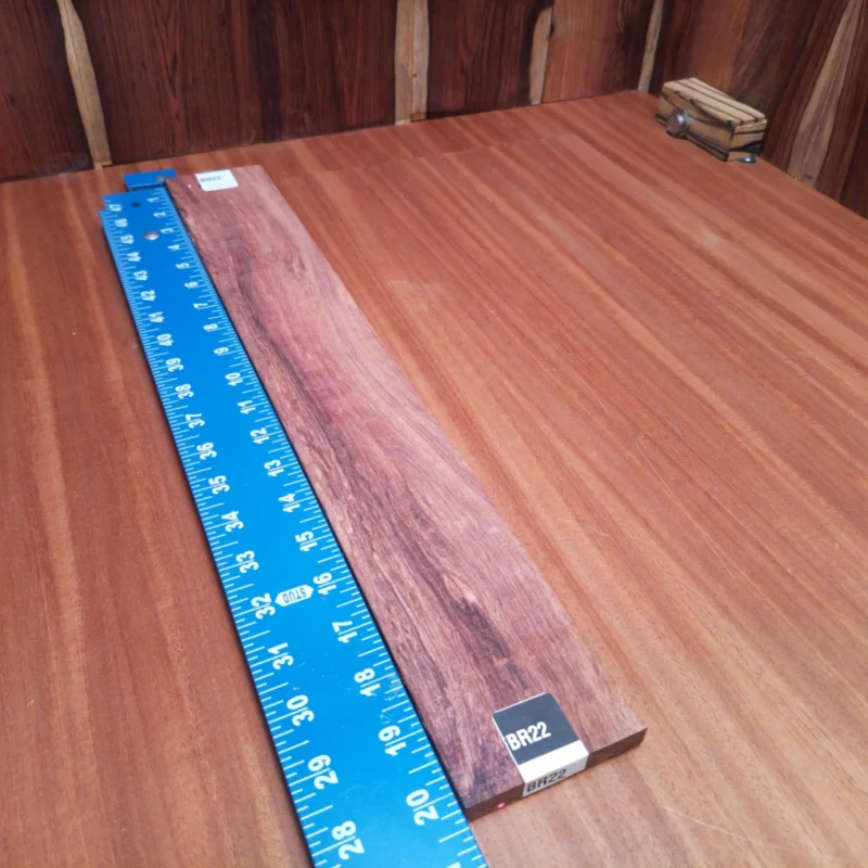 Crafted from premium Honduran Rosewood, this fingerboards blank is perfect for luthiers seeking a beautiful, durable wood. Its rift sawn cut ensures stunning visual appeal while allowing for excellent grain alignment, ideal for resonant, high-quality acoustic performance. Elevate your stringed instrument craft with this fine piece of wood that’s perfect for any serious luthier's toolkit. Get ready to carve out your next masterpiece! It is a Honduran Rosewood Acoustic Rift Sawn fingerboard blank with dimensions of 20.3 x 2.8 x 0.4 inches.