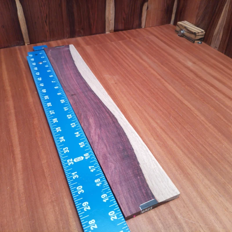 Unlock your creativity with this Honduran Rosewood blank, perfect for luthiers looking to craft stunning acoustic instruments. With a rich, vibrant tone and beautiful grain patterns, this top-quality wood enhances both aesthetics and sound. Durability meets elegance, making it ideal for passionate builders crafting their next masterpiece. Elevate your instrument-making game with this versatile rosewood blank and experience superior tonal properties with every strum. It is a Honduran Rosewood Acoustic Rift Sawn fingerboard blank with dimensions of 20.3 x 3.2 x 0.4 inches.