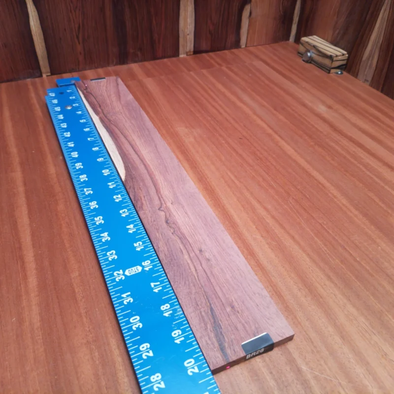 Crafted from premium Honduran Rosewood, this fingerboard blank is perfect for luthiers seeking both style and sound. Its rich, dark grain and smooth finish ensure a responsive playing experience while adding elegant aesthetics to any instrument. Make your acoustic guitar stand out with this high-quality, durable blank that enhances tonal clarity and resonance. Ready for your next project? This is the perfect choice! It is a Honduran Rosewood Acoustic Rift Sawn fingerboard blank with dimensions of 20.3 x 2.9 x 0.4 inches.