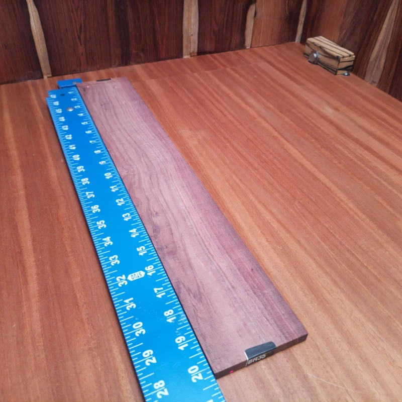 Honduran Rosewood Acoustic Rift Sawn Fingerboard Blank 0.4" X 3.2" X 20.3" - HRAFBR000035 3 Crafted from premium Honduran Rosewood, this fingerboard blank combines durability with stunning aesthetics. Perfect for luthiers, it shapes beautifully and enhances any acoustic instrument with its rich tones. Experience the superior craftsmanship, consistent grain, and vibrant coloration, allowing for a delightful finishing touch on your latest project. Elevate your craft with this exceptional fingerboard blank that promises quality and style in every detail. It is a Honduran Rosewood Acoustic Rift Sawn fingerboard blank with dimensions of 20.3 x 3.2 x 0.4 inches.