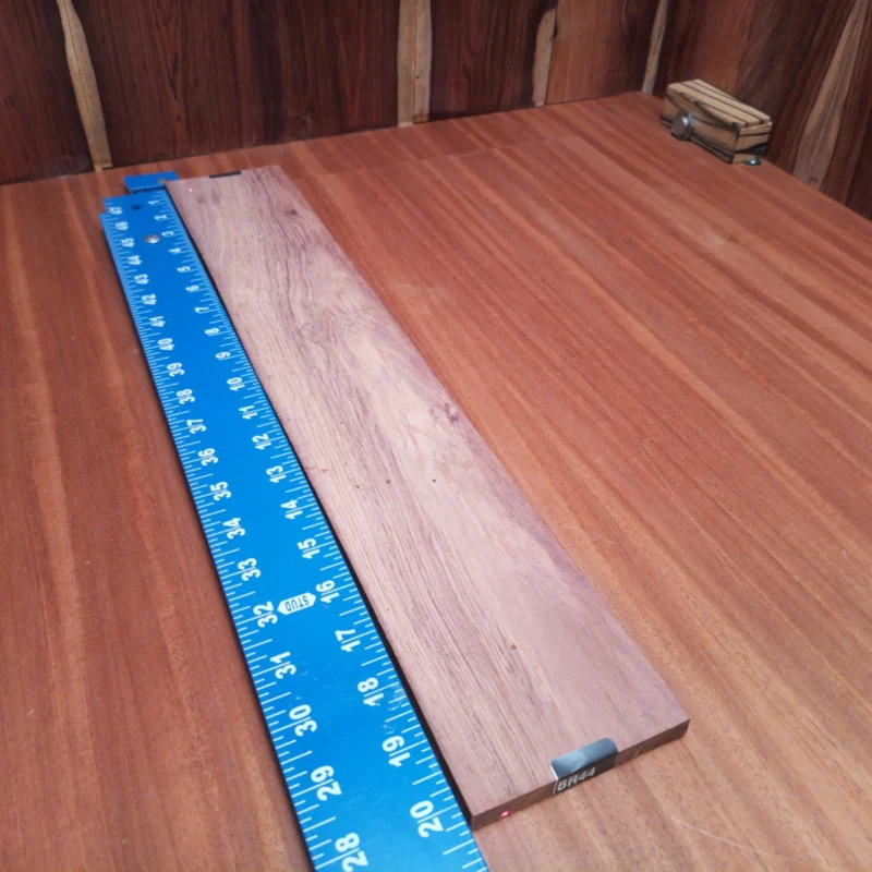 Unlock the potential of your next project with this Honduran Rosewood blank. Perfectly rift sawn, it boasts a rich, vibrant grain and exceptional resonance, ideal for crafting high-quality acoustic instruments. Luthiers will appreciate its stability and tonal richness, making it a fantastic choice for guitars and more. Elevate your craftsmanship with this versatile material that promises both beauty and performance. It is a Honduran Rosewood Acoustic Rift Sawn fingerboard blank with dimensions of 20.2 x 3.4 x 0.4 inches.