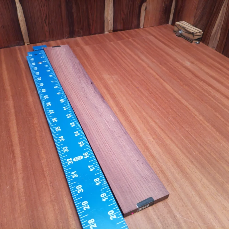 Unlock your creative potential with this Honduran Rosewood fingerboards blank! Crafted for luthiers, it offers a stunning grain and rich color. Perfect for enhancing your acoustic instruments, this high-quality wood ensures vibrant tones that resonate beautifully. Whether you're a seasoned pro or just starting out, this fingerboards blank is your ticket to crafting remarkable sounds and unforgettable music. Get ready to turn heads and ears alike! It is a Honduran Rosewood Acoustic Rift Sawn fingerboard blank with dimensions of 20.2 x 2.7 x 0.4 inches.