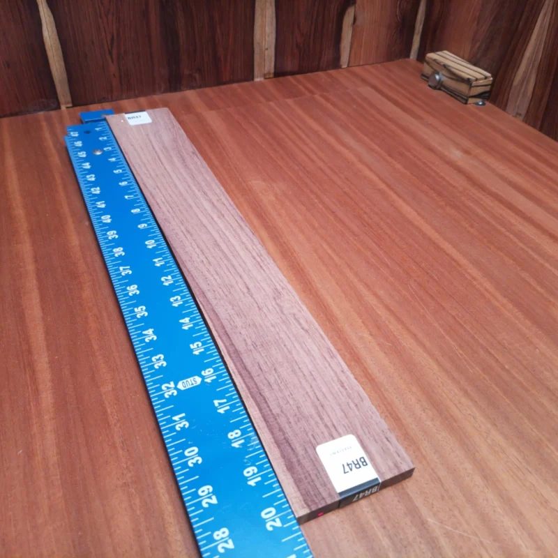 Crafted from quality Honduran rosewood, this fingerboard blank provides unparalleled resonance and warmth. Perfect for luthiers seeking a reliable material, it offers just the right stiff flexibility. Whether you're designing an acoustic masterpiece or need a reliable replacement, this blank guarantees a smooth, easy-to-work surface. Plus, its stunning grain adds natural beauty to any project, elevating your instrument's character. It is a Honduran Rosewood Acoustic Rift Sawn fingerboard blank with dimensions of 20.3 x 2.9 x 0.4 inches.