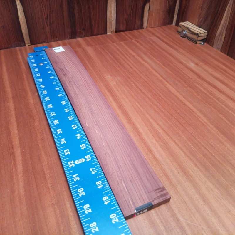 Fingerboard Blanks 129 Explore the beauty and depth of sound with this Honduran Rosewood fingerboards blank. Perfect for luthiers looking to create stunning acoustic masterpieces, its rift-sawn grain ensures a beautiful finish while providing excellent tonal qualities. Ideal for both acoustic and electric guitars, this blank delivers durability and elegance in one piece. Unlock your creativity with this versatile and high-quality wood that enhances playability and aesthetic appeal, making every note resonate beautifully. It is a Honduran Rosewood Acoustic Rift Sawn fingerboard blank with dimensions of 20.3 x 2.7 x 0.4 inches.