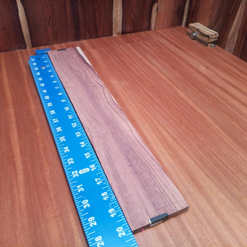 Crafted from premium Honduran Rosewood, this fingerboard blank combines beauty and durability. With its rich tonal qualities, it’s perfect for luthiers creating exquisite acoustic instruments. Its precise rift sawing enhances stability, making it ideal for quality builds. Elevate your craftsmanship and impress players with this luxurious, easy-to-work-with wood that delivers outstanding sound and performance. It is a Honduran Rosewood Acoustic Rift Sawn fingerboard blank with dimensions of 20.2 x 3.4 x 0.4 inches.
