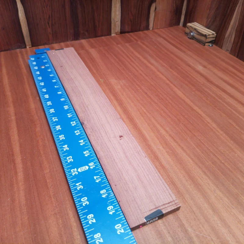 Honduran Rosewood Acoustic Rift Sawn Fingerboard Blank 0.4" X 2.9" X 20.2" - HRAFBR000058 3 Elevate your crafting game with this Honduran Rosewood blank. Perfect for luthiers, its rich tones and superior density provide incredible resonance, making every note shine. The natural beauty of this rift-sawn wood ensures an eye-catching finish that enhances both sound quality and aesthetics. Whether you're a seasoned pro or an ambitious apprentice, this fingerboard blank is your ticket to creating beautiful string instruments that resonate with character and depth. It is a Honduran Rosewood Acoustic Rift Sawn fingerboard blank with dimensions of 20.2 x 2.9 x 0.4 inches.