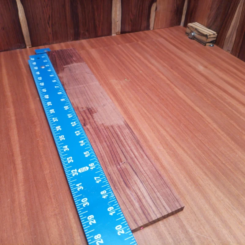 Unlock the potential of your next acoustic masterpiece with this Honduran Rosewood blank. Designed for luthiers who appreciate quality, its rift sawn cut showcases a stunning grain pattern ideal for vibrant sound projection and resonance. Whether you're crafting a new guitar or refining an old one, this fingerboard will elevate your instrument's aesthetic and acoustic performance to professional levels. Get ready to impress your audience! It is a Honduran Rosewood Acoustic Rift Sawn fingerboard blank with dimensions of 20.2 x 3.0 x 0.4 inches.