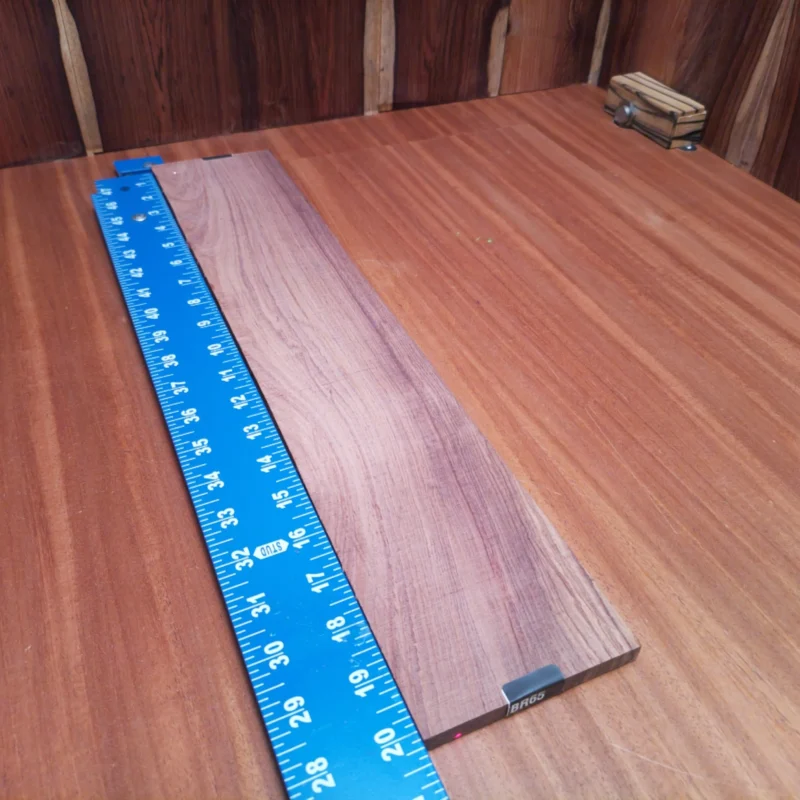Elevate your luthier craft with this stunning Honduran Rosewood blank. Perfect for acoustic guitar backs or sides, its rich tonal qualities and striking grain ensure that every note resonates beautifully. This versatile wood is not just a pretty face; it also offers excellent durability under pressure. Experience the blend of beauty and functionality with this fingerboard blank that luthiers will love to work with! It is a Honduran Rosewood Acoustic Rift Sawn fingerboard blank with dimensions of 20.3 x 3.9 x 0.4 inches.