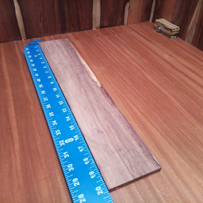 Unlock the full potential of your acoustic instruments with this premium Honduran Rosewood fingerboards blank. Renowned for its rich tonal qualities and stunning appearance, this rift sawn piece is perfect for luthiers looking to elevate their craft. Ideal for creating vibrant soundscapes, this blank offers excellent workability and durability, ensuring exceptional playability for years to come. Embrace the beauty of nature while crafting your next masterpiece! It is a Honduran Rosewood Acoustic Rift Sawn fingerboard blank with dimensions of 20.2 x 3.8 x 0.4 inches.