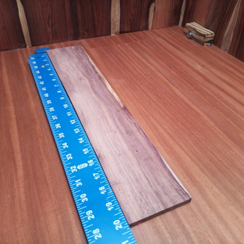 Discover the beauty of Honduran Rosewood in this acoustic fingerboard blank. Perfectly crafted for luthiers, it offers outstanding tonal properties and aesthetic appeal. The rich, warm tones and striking grain patterns make it an ideal choice for high-quality instruments. Elevate your craft and enhance your builds with this durable, versatile fingerboard blank that promises both sustainability and performance. Your next guitar project deserves a touch of elegance. It is a Honduran Rosewood Acoustic Rift Sawn fingerboard blank with dimensions of 20.4 x 3.8 x 0.4 inches.