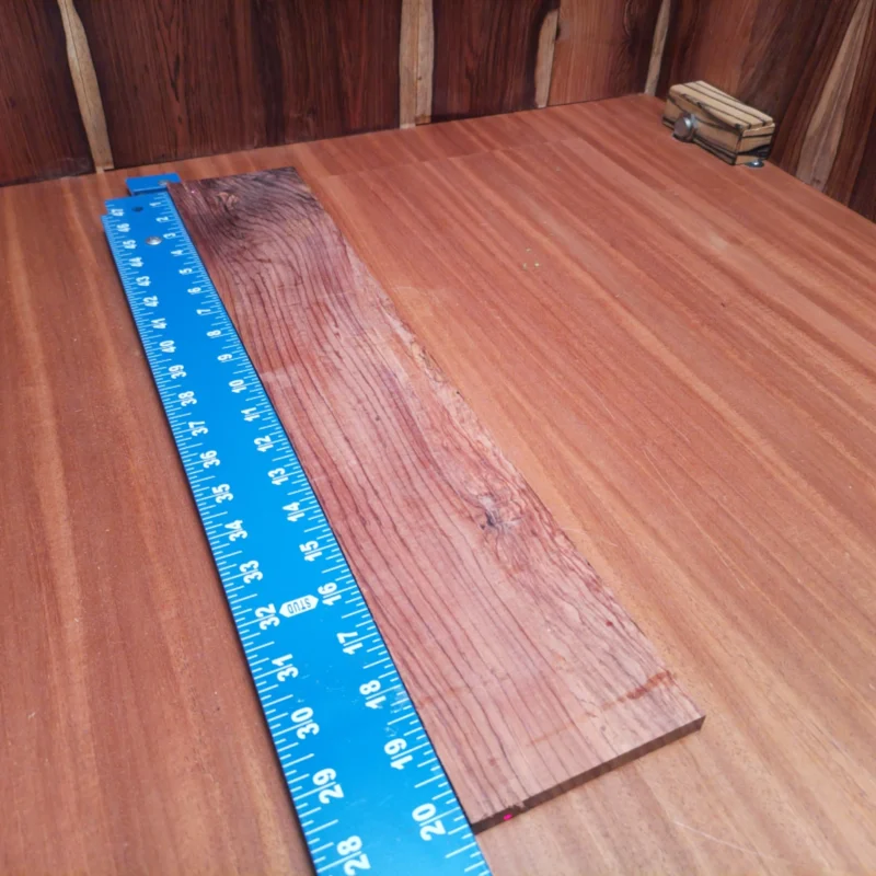 Honduran Rosewood Acoustic Rift Sawn Fingerboard Blank 0.4" X 3.8" X 20.3" - HRAFBR000081 3 Elevate your instrument crafting with this premium Honduran Rosewood blank. Perfectly suited for luthiers, its rich, resonant tone and lovely finish will enhance any acoustic creation. The fine grain and durability ensure that your fingerboards will stand the test of time while providing an outstanding playability experience for musicians. Transform your vision into reality with this exquisite piece of wood tailored for serious builders. It is a Honduran Rosewood Acoustic Rift Sawn fingerboard blank with dimensions of 20.3 x 3.8 x 0.4 inches.