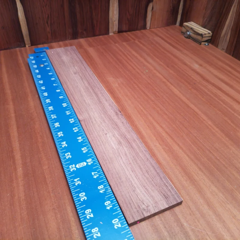 Elevate your luthiery game with this stunning Honduran Rosewood blank. With its rich tonal qualities and beautiful grain patterns, this wood is perfect for crafting acoustic instruments that resonate beautifully and please the eye. Measuring 0.4" x 3.1" x 20.3", it offers ample surface area for various projects while ensuring durability and stability. Get ready to unleash your creativity and enhance your builds with this premium choice for serious luthiers! It is a Honduran Rosewood Acoustic Rift Sawn fingerboard blank with dimensions of 20.3 x 3.1 x 0.4 inches.