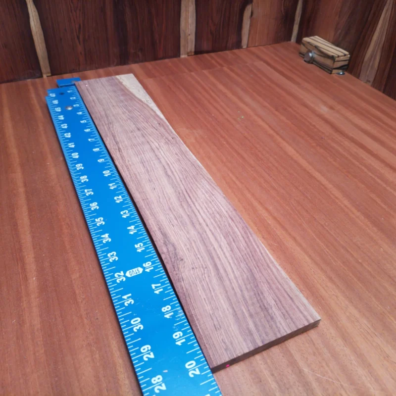 Elevate your instrument making with this Honduran Rosewood acoustic blank. Its rift sawn design showcases a beautiful grain, ideal for luthiers seeking quality and aesthetics. This fingerboard blank balances durability and resonance, promising a rich sound. Perfect for guitars, ukuleles, or other string instruments, it's easy to work with and guarantees a sturdy fit. Transform your next project with this stunning wood and let your creativity flow! It is a Honduran Rosewood Acoustic Rift Sawn fingerboard blank with dimensions of 20.3 x 3.9 x 0.4 inches.