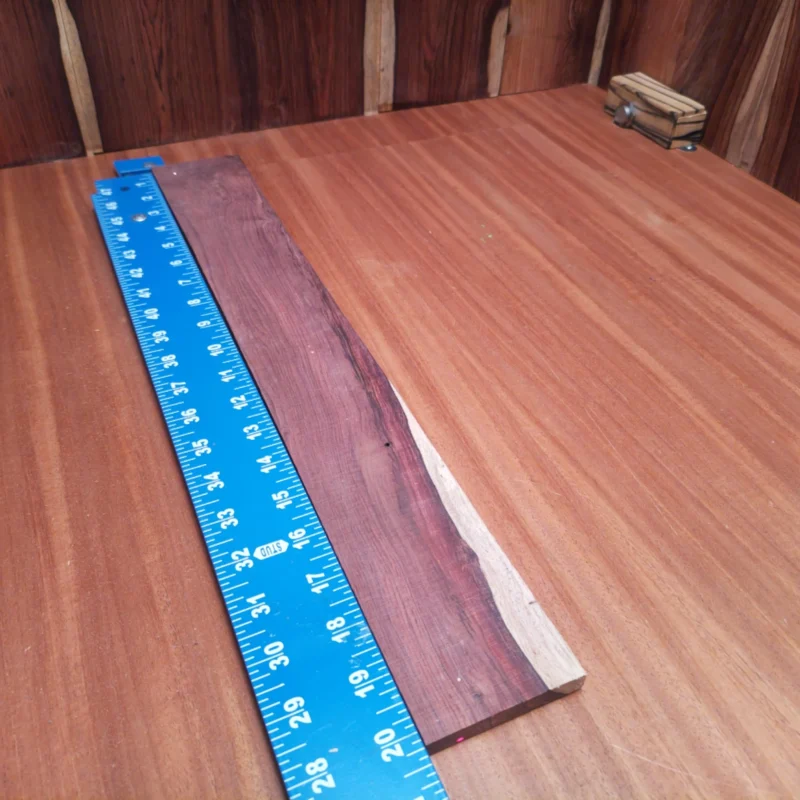 Honduran Rosewood Acoustic Rift Sawn Fingerboard Blank 0.4" X 2.7" X 20.3" - HRAFBR000090 3 Elevate your acoustic builds with this premium Honduran Rosewood blank. Known for its striking grain and vibrant tonal qualities, this rift sawn piece is perfect for crafting superior fingerboards. Experience the blend of beauty and functionality that seasoned luthiers cherish in their instruments. With its perfect dimensions, you’ll be able to unleash your creativity and deliver tones that resonate perfectly with musicians. Get ready to create masterpieces! It is a Honduran Rosewood Acoustic Rift Sawn fingerboard blank with dimensions of 20.3 x 2.7 x 0.4 inches.