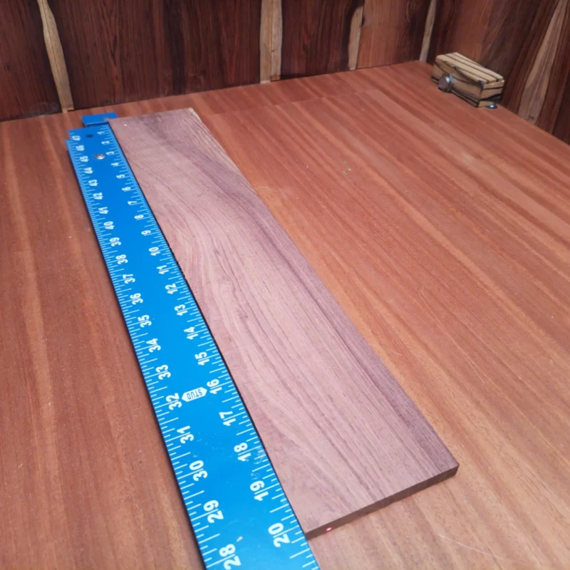Crafted from premium Honduran rosewood, this acoustic fingerboard blank is a luthier's dream. Its impressive density ensures remarkable tonal clarity and depth, making your instruments sing. Whether you're building custom guitars or refurbishing classics, this high-quality timber provides the perfect canvas for your next project. Get ready to elevate your craft with this stunning, versatile wood—perfect for both novice and professional luthiers alike! It is a Honduran Rosewood Acoustic Rift Sawn fingerboard blank with dimensions of 20.2 x 3.8 x 0.4 inches.