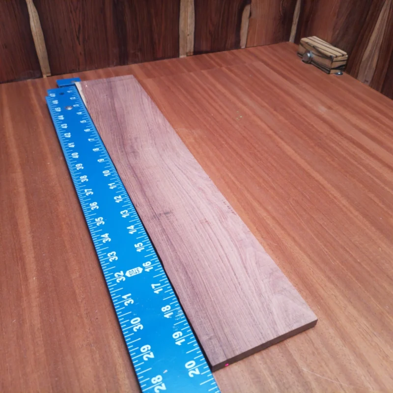 Crafted from premium Honduran rosewood, this acoustic fingerboard blank is a luthier's dream. Its impressive density ensures remarkable tonal clarity and depth, making your instruments sing. Whether you're building custom guitars or refurbishing classics, this high-quality timber provides the perfect canvas for your next project. Get ready to elevate your craft with this stunning, versatile wood—perfect for both novice and professional luthiers alike! It is a Honduran Rosewood Acoustic Rift Sawn fingerboard blank with dimensions of 20.2 x 3.8 x 0.4 inches.