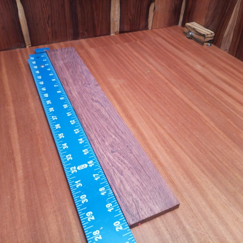 Honduran Rosewood Acoustic Rift Sawn Fingerboard Blank 0.4" X 2.9" X 20.3" - HRAFBR000095 3 This Honduran Rosewood blank is perfect for crafting unique acoustic instruments. Its rich tone and stunning grain patterns make each piece a masterclass in luthiery. With excellent tonal properties and durability, this wood is ideal for luthiers seeking to elevate their guitar-making game. Transform your projects with this inspiration-packed wood, perfect for both novice and experienced creators alike. It is a Honduran Rosewood Acoustic Rift Sawn fingerboard blank with dimensions of 20.3 x 2.9 x 0.4 inches.