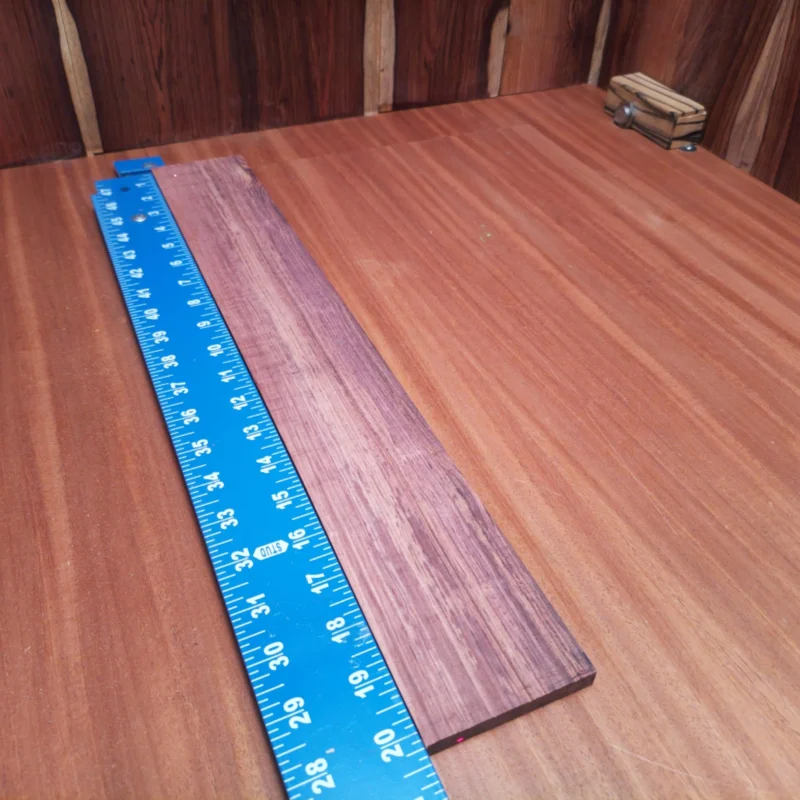 Fingerboard Blanks 42 Unlock your creativity with this stunning Honduran Rosewood fingerboards blank. Renowned for its rich tonal qualities and stunning aesthetics, this piece is perfect for luthiers looking to craft something truly special. With a thickness and dimension that encourages easy shaping and finishing, your next acoustic masterpiece awaits. Enhance playability and sound with this premium wood that delivers both style and performance. It is a Honduran Rosewood Acoustic Rift Sawn fingerboard blank with dimensions of 20.3 x 2.9 x 0.3 inches.
