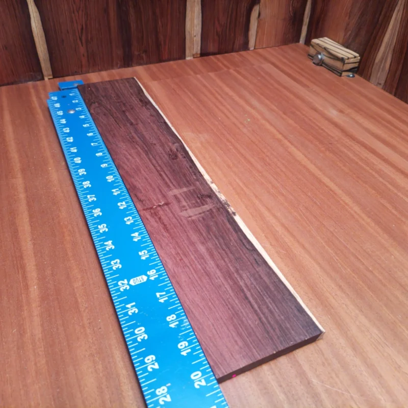 Elevate your builds with this Honduran Rosewood blank, perfect for acoustic projects. Renowned for its stunning tonal qualities, it offers luthiers a rich palette of sound while adding an attractive aesthetic. Whether you're crafting a guitar, ukulele, or other string instruments, this rosewood blank is an essential choice for quality craftsmanship and resonance. Get ready to create music that resonates! It is a Honduran Rosewood Acoustic Rift Sawn fingerboard blank with dimensions of 20.3 x 3.8 x 0.4 inches.