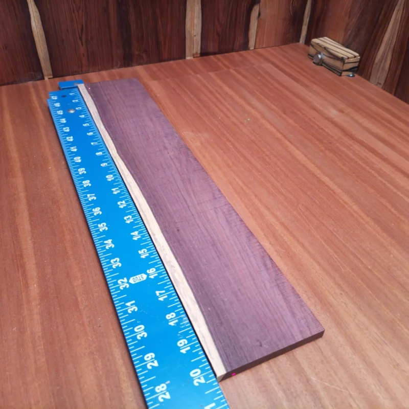 Elevate your builds with this Honduran Rosewood blank, perfect for acoustic projects. Renowned for its stunning tonal qualities, it offers luthiers a rich palette of sound while adding an attractive aesthetic. Whether you're crafting a guitar, ukulele, or other string instruments, this rosewood blank is an essential choice for quality craftsmanship and resonance. Get ready to create music that resonates! It is a Honduran Rosewood Acoustic Rift Sawn fingerboard blank with dimensions of 20.3 x 3.8 x 0.4 inches.