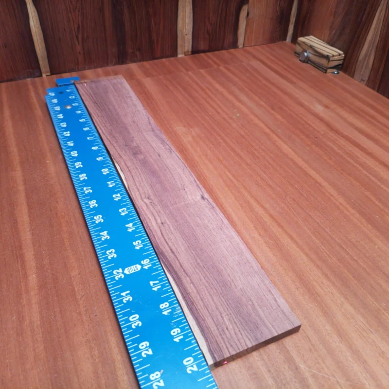 Craft your next acoustic masterpiece with this Honduran Rosewood Blank. Boasting a beautifully rift-sawn surface, it delivers superior tonal qualities and aesthetic appeal. Ideal for luthiers seeking durability and a rich, warm sound. With easy workability and striking grain patterns, this fingerboard blank is your ticket to making instruments that resonate with character and quality at every note. It is a Honduran Rosewood Acoustic Rift Sawn fingerboard blank with dimensions of 20.2 x 3.2 x 0.4 inches.