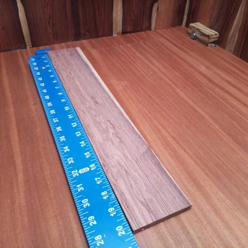Unlock the full potential of your acoustic builds with our premium Honduran Rosewood blank. With its rich tone and tight grain patterns, this rift-sawn wood ensures durable resonance and stunning aesthetics. Perfect for luthiers seeking that perfect combination of quality and beauty, this fingerboard blank delivers superior playability. Elevate your next project with this exquisite piece that's sure to impress both you and your audience. It is a Honduran Rosewood Acoustic Rift Sawn fingerboard blank with dimensions of 20.3 x 3.3 x 0.4 inches.