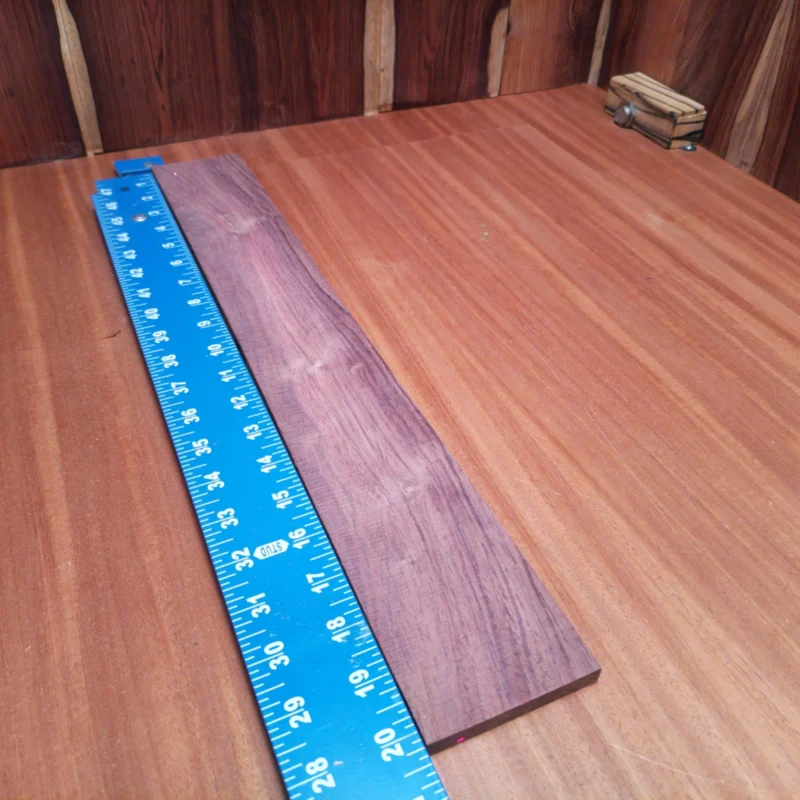 Honduran Rosewood Acoustic Rift Sawn Fingerboard Blank 0.4" X 2.8" X 20.3" - HRAFBR000112 3 Craft your next masterpiece with this top-grade Honduran Rosewood acoustic fingerboard blank. Its rift sawn cut ensures unmatched stability and resonance. Perfect for luthiers seeking a rich tone and stunning grain patterns, this blank is ready to transform your instrument with beauty and sound. Elevate your craftsmanship, as this high-quality wood guarantees durability and an exceptional playing experience. Step up your game with this remarkable addition to your toolkit! It is a Honduran Rosewood Acoustic Rift Sawn fingerboard blank with dimensions of 20.3 x 2.8 x 0.4 inches.