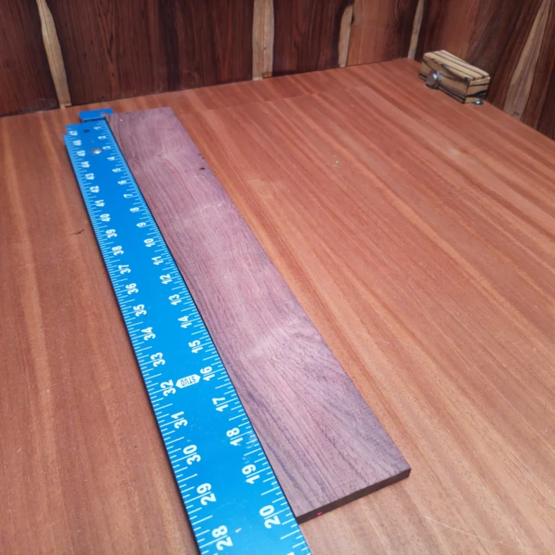 Honduran Rosewood Acoustic Rift Sawn Fingerboard Blank 0.4" X 3.0" X 20.3" - HRAFBR000114 3 Crafted for serious luthiers, this Honduran Rosewood blank boasts striking grain patterns and durable quality. Perfect for creating vibrant acoustic instruments, it enhances tonal warmth and resonance. With its ideal dimensions, it's ready for your next project, enabling you to shape a masterpiece that sounds as good as it looks. Elevate your crafting game with this premium wood! It is a Honduran Rosewood Acoustic Rift Sawn fingerboard blank with dimensions of 20.3 x 3.0 x 0.4 inches.