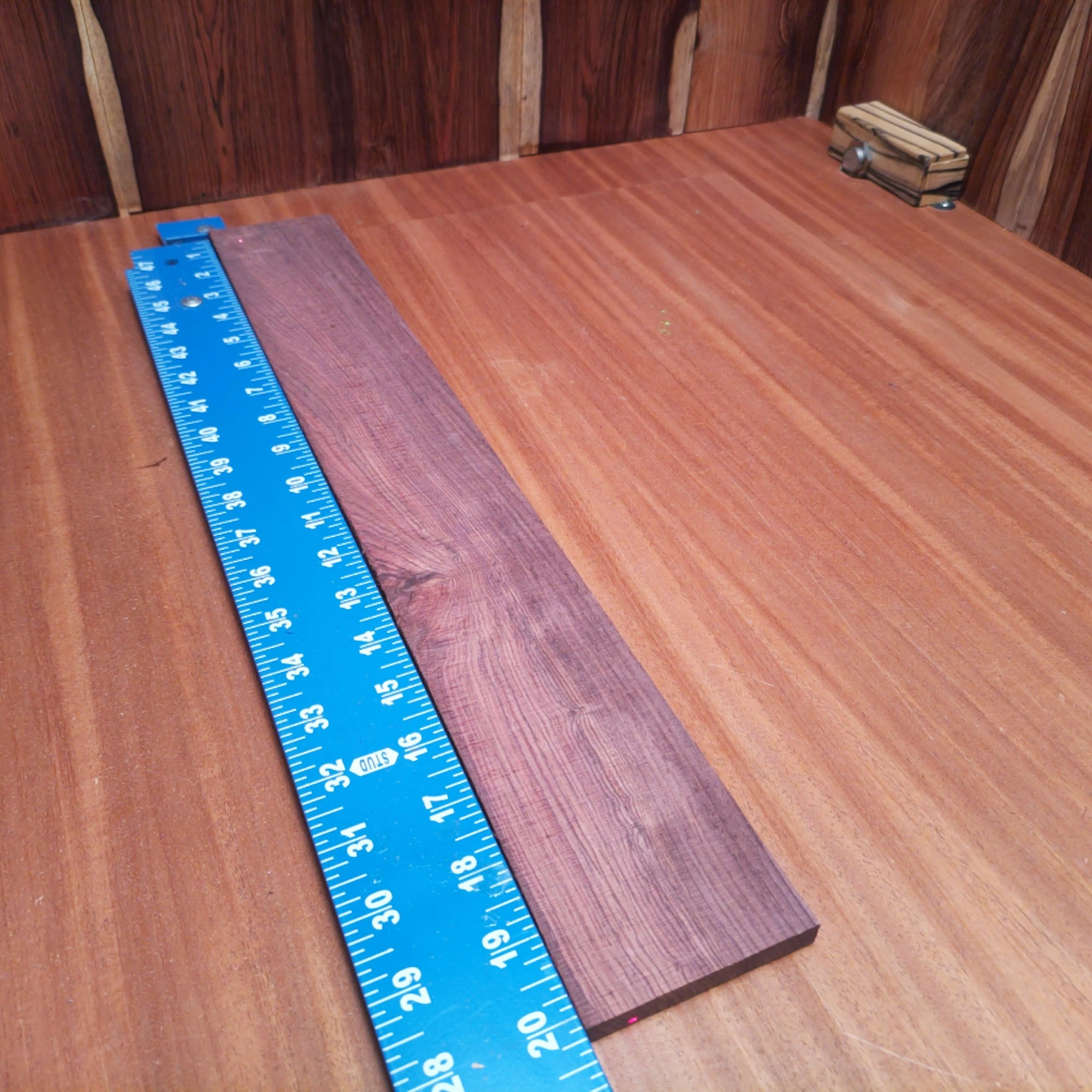 Honduran Rosewood Acoustic Rift Sawn Fingerboard Blank 0.4" X 2.9" X 20.1" - HRAFBR000115 2 Craft your next masterpiece with this high-quality Honduran Rosewood fingerboard blank. Perfectly suited for luthiers, its rich color and warm tonal properties enhance any acoustic guitar. This blank is designed to facilitate smooth playability and superb resonance, ensuring that your instrument stands out in both sound and aesthetics. Whether you’re a seasoned pro or just starting, this blank offers the ideal balance of beauty and functionality. It is a Honduran Rosewood Acoustic Rift Sawn fingerboard blank with dimensions of 20.1 x 2.9 x 0.4 inches.