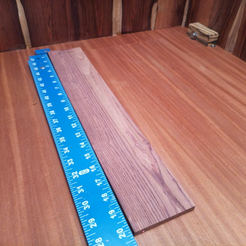 Honduran Rosewood Acoustic Rift Sawn Fingerboard Blank 0.4" X 3.4" X 20.1" - HRAFBR000116 3 Elevate your instrument-building game with this Honduran Rosewood blank. Known for its rich tonal properties and stunning grain, this Rift Sawn piece is perfect for luthiers seeking a robust sound. Ideal for acoustic guitar backs and sides, it will enhance the resonance of your creations. Get ready to impress musicians with a beautiful, quality instrument that stands out in both performance and appearance. It is a Honduran Rosewood Acoustic Rift Sawn fingerboard blank with dimensions of 20.1 x 3.4 x 0.4 inches.
